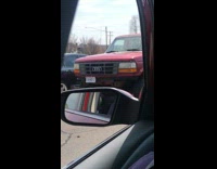 Red Ford truck as the Audi logo on its front grills