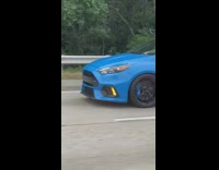 Man inside car trunk films sports car behind on the highway