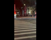 Firefighters extinguish fire inside the trash bin