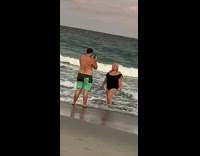 Black bathing suit girl ocean guy sunset