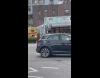 Biker balances trash can on head Part 2 