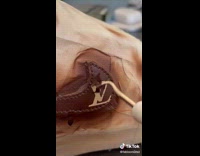 Person makes custom LV logo shoe 