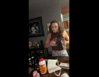 Girl spits out shot into camera 