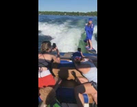 Blue graduation gown girl board boat lake 