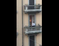 Guy white long sleeves balcony railings selfie