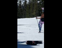 Collab IITW - Woman in sports bra bunny ears poses at the snowy mountain