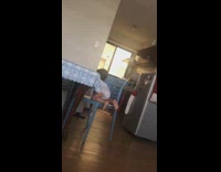 Little boy climbs on chair and table to get food
