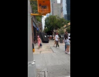 Walk sign holding on for dear life