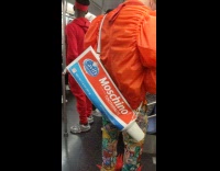 Collab winy - Man with giant moschino toothpaste bag riding subway