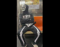 Collab WINY - Man sit on the train wear halloween costume in NY 