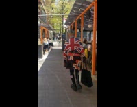 Guy with hair gelled in spikes and british flag outfit
