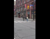 Guy girl matching black jacket pose crosswalk