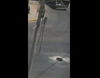 Man falls into manhole while crossing a busy street