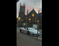 Lady photographs sunset outside 