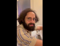 Woman shows concert outside hotel through window