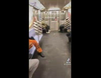 Woman on subway records herself posing for pictures and video