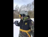 Guy camo jacket does a flip off ramp, hits head in snow and breaks wrist