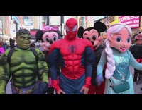 man dressed as spiderman walks around times square