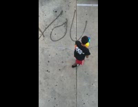 Guy spells youre mom on floor with water gun