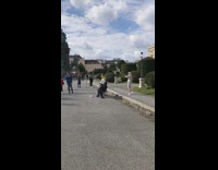 White horse mask street performer white skirt