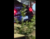 Blue car with Harrow license plate 
