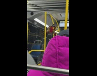 Guy with toys at top of the head inside train 