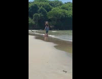 Man shoulder carry woman take picture beach