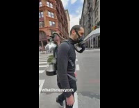 Man Wears Plant like a Backpack Attached to his Mask 