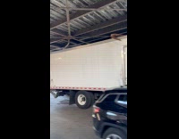 Container truck roof gets caught on metal