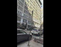 Street Signage Shakes as Heavy Wind Blows