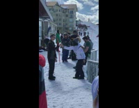 Woman beanie jacket sit on ledge snow mountain