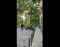 White shirt girl sits poses yellow motorcycle 