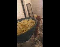 Hamster climbs blue bowl steals one piece of popcorn