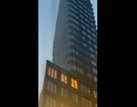 Collab WINY - Water mist fall down from a building one way street sign can be seen