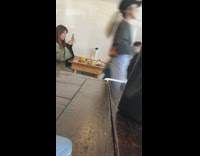Girl takes photo at cafe