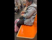 Woman does nail polish on subway ride