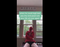 Red sweater girl tightens hood around face 