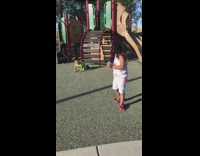 Little boy in green falls off jungle gym in background girl with egg in diaper