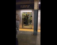 Man playing violin inside subway