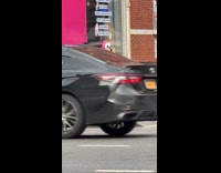 Man clown mask flex chest muscles street