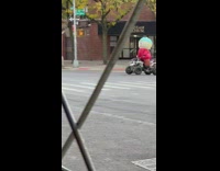 Person in Cartman Inflatable Costume Rides ATV
