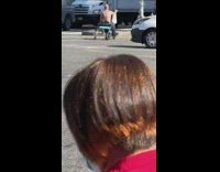 Person in mobile scooter chair drives on street 