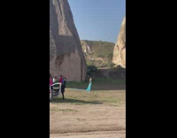 Woman in light blue dress runaway video shoot