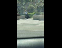 Woman white top tiktok dance church gate