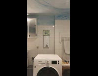 Woman elbow stand on washing machine falls