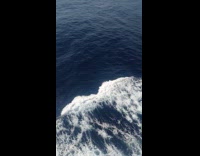 Waves on the ocean created by ship