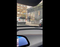 Man green durag dances on the sidewalk