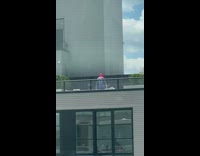 Person in spiderman outfit on rooftop patio