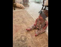 Husky dog does low growl and baby enjoys it