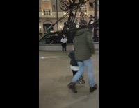 Two women tiktok dance while child watches